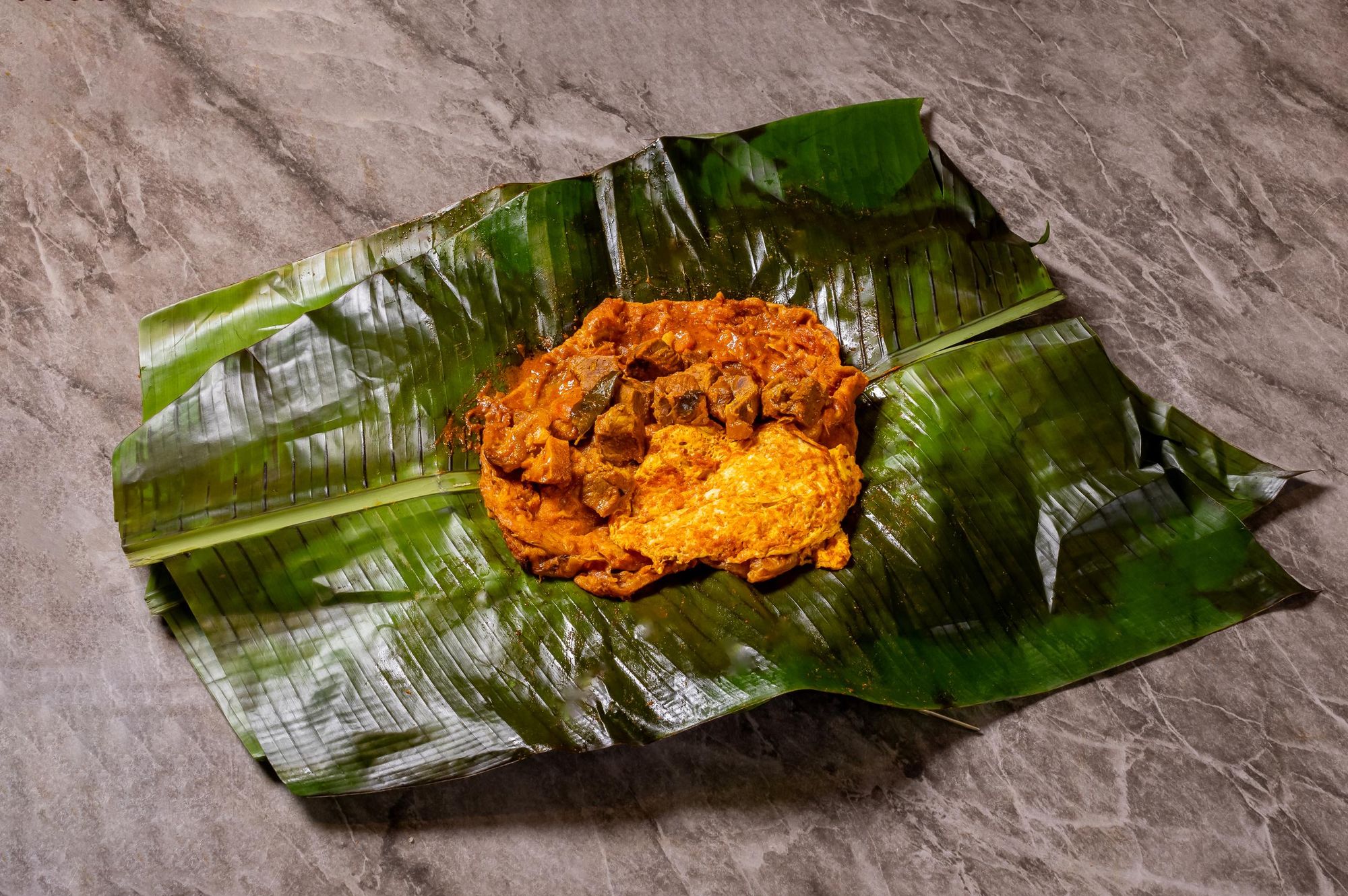 Kizhi parotta opened on banana leaf